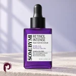 بطری بنفش سرم Retinol Intense سام بای می روی سطح سنگی