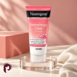 مرطوب‌کننده نوتروژینا Refreshingly Clear روی پایه شیشه‌ای با زمینه صورتی و کرم